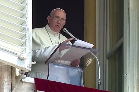 Pope Francis delivers his Angelus address from the window of the Papal apartment