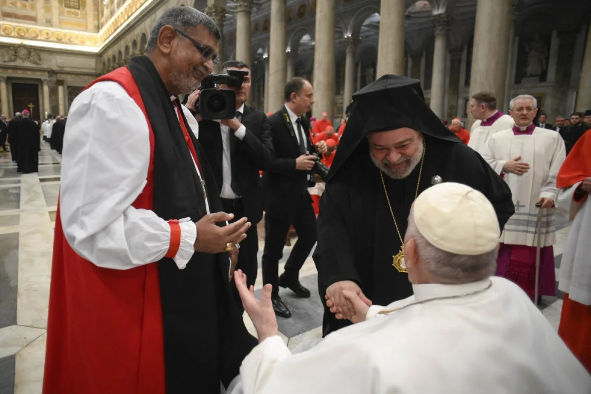 Pope Francis meets Anglican Archbishop Ian Ernest, the Archbishop of Canterbury's representative in Rome, and Orthodox Metropolitan Polykarpos of Italy, the Ecumenical Patriarchate's representative in Rome, during an ecumenical evening prayer service marking the end of the Week of Prayer for Christian Unity at the Basilica of St. Paul Outside the Walls in Rome