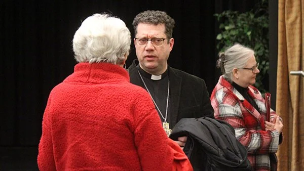 De Margerie series speaker, Anglican Bishop Bruce Myers, chats after his Saskatoon lecture at St. Thomas More College