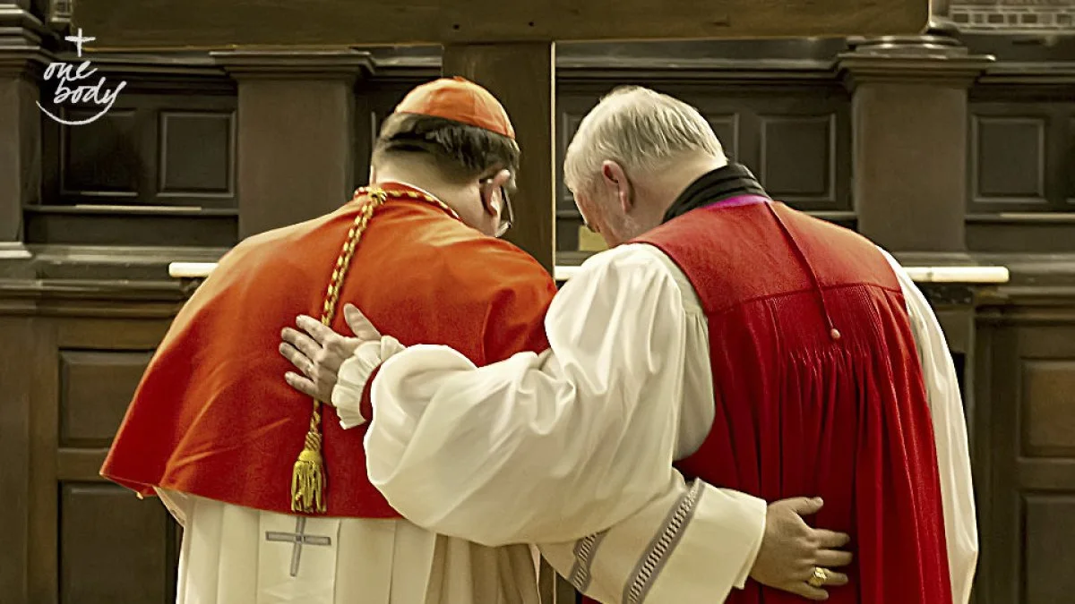 Cardinal Gérald Cyprien Lacroix, Archbishop of Quebec and Primate of Canada, prays in front of a cross with Bishop Dennis Drainville, Anglican Bishop of the Diocese of Quebec (2009-2017), on Good Friday 2014