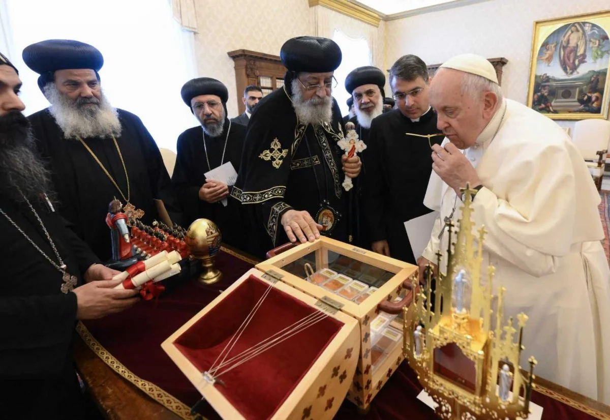 Pope Francis kisses one of the relics Coptic Orthodox Pope Tawadros II of Alexandria, Egypt, gave him of the 21 Coptic martyrs murdered by Islamic State terrorists in 2015 The two popes met in the library of the Apostolic Palace in Rome