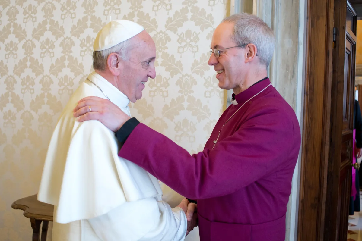 Pope Francis and Archbishop Justin Welby greet during Welby's visit to Rome