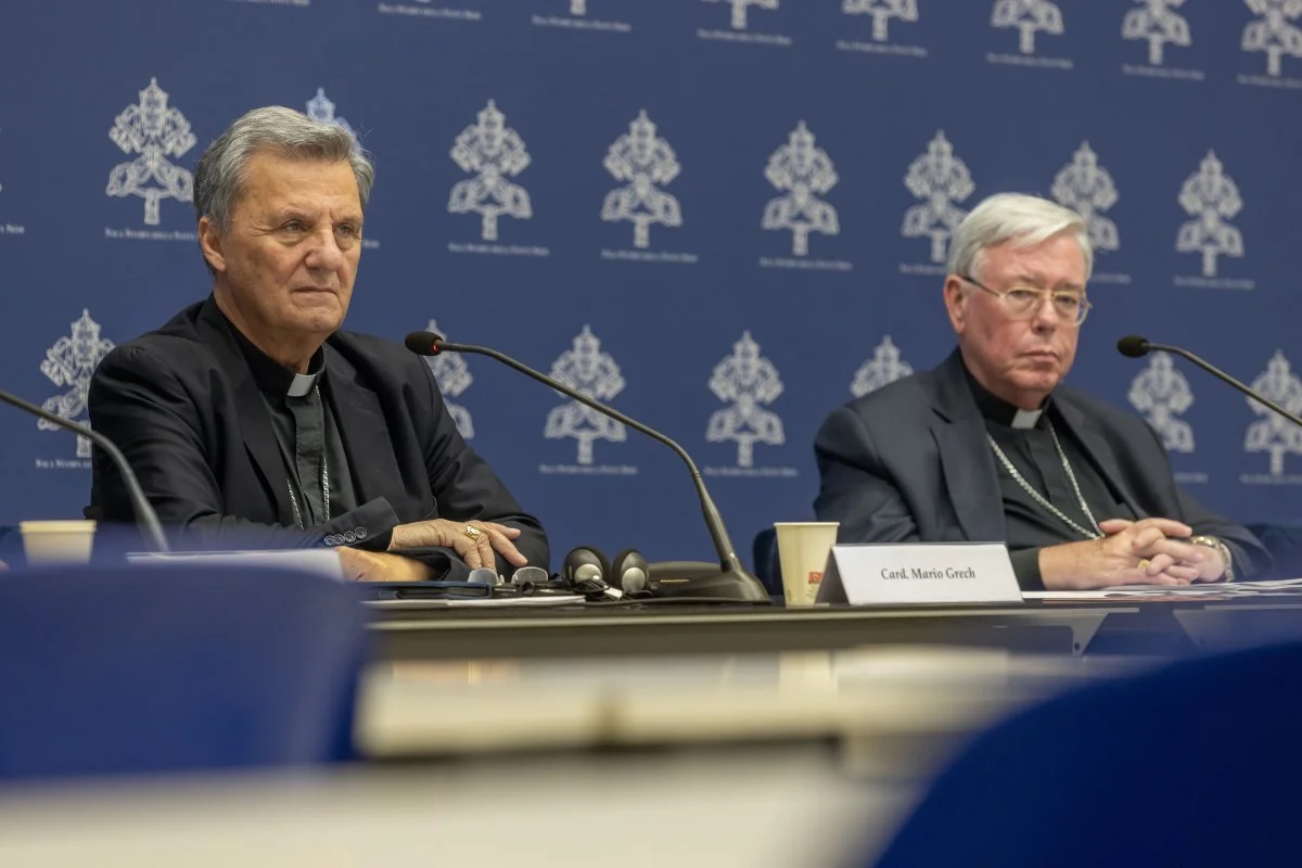 Cardinal Mario Grech, secretary-general of the synod, and Cardinal Jean-Claude Hollerich, relator general of the synod, attend a news conference at the Vatican to present the calendar and list of participants for the second session of the ongoing Synod of Bishops