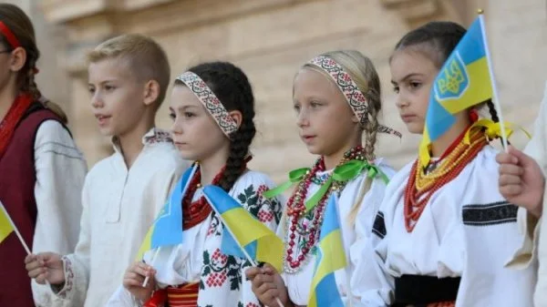 A Ukrainian children's choir in St. Peter's Square for an ecumenical prayer service titled 'Together: Gathering of the People of God'. The prayer service occurred the day before the beginning of the 1st Session of the XVI Ordinary General Assembly of the Synod of Bishops