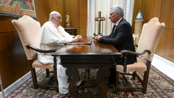 Pope Francis speaks with Cuban President Miguel Díaz-Canel during a private meeting in the papal studio of the Vatican audience hall
