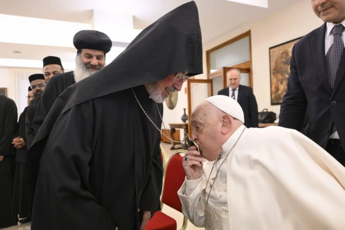 Pope Francis kisses the encolpion of Archbishop Khajag Barsamian, the representative of the Armenian Orthodox Church to the Holy See, during a meeting at the Vatican with young priests and monks from Oriental Orthodox churches