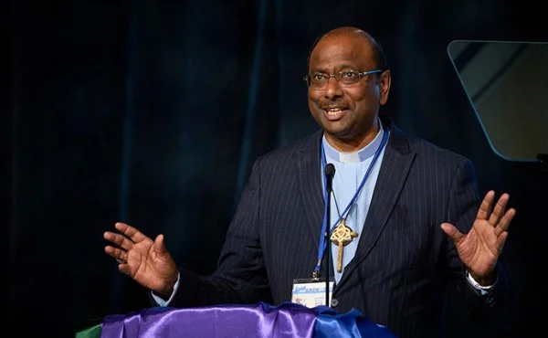 The Rev. Jerry Pillay gives the sermon during morning worship at the United Methodist General Conference in Charlotte, NC. The general secretary of the World Council of Churches, Pillay told conference delegates, 'Christian unity matters.'