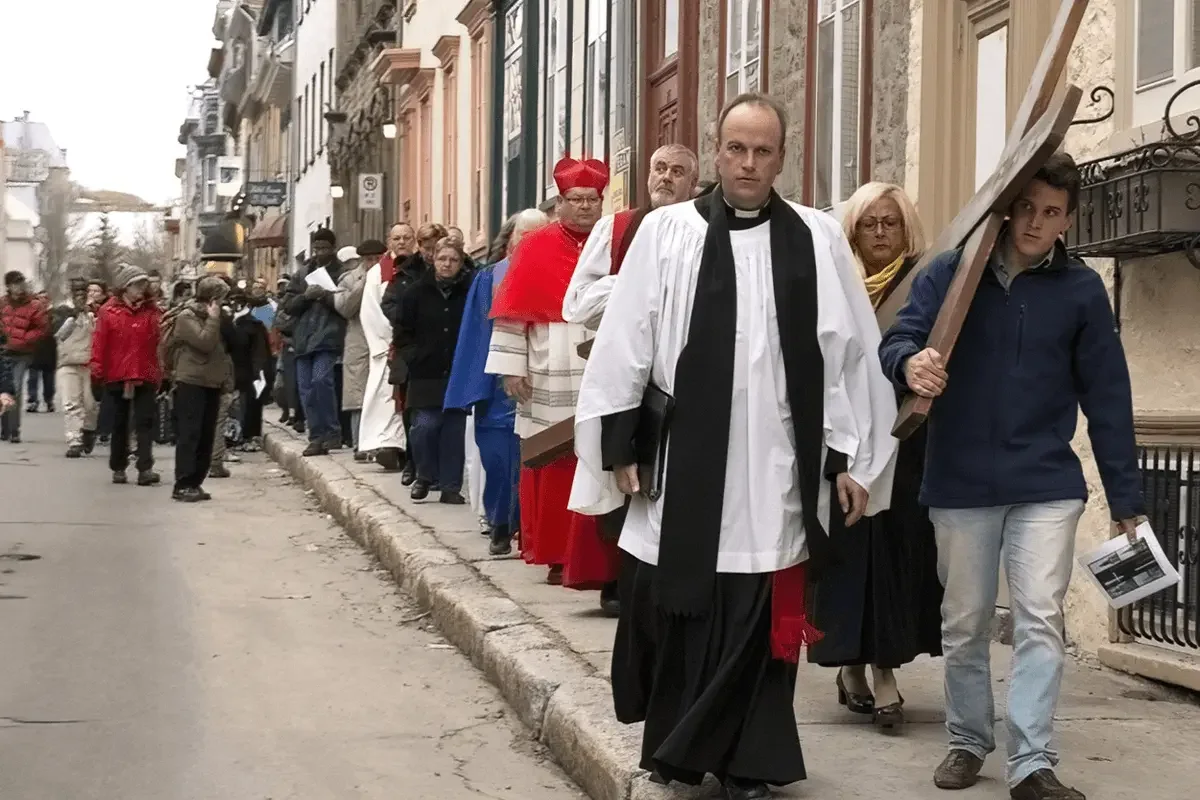 People participate in the annual Good Friday Way of the Cross procession through the streets of Montreal, Quebec