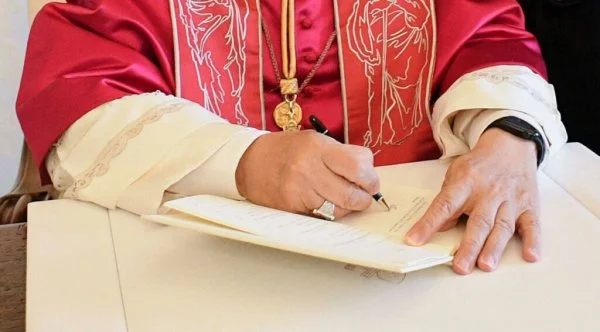 Pope Leo XIV signing his first major document, the Apostolic Exhortation <i>Dilexi te</i> (Latin for 'I have loved you'), focusing on love for the poor, on the feast day of St. Francis of Assisi
