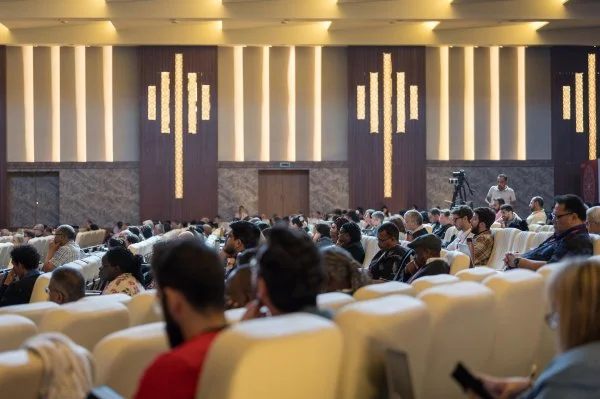 People attend a plenary on 'Living Visible Unity' at the World Council of Churches Sixth World Conference on Faith and Order in Wadi El Natrun, Egypt, around the theme 'Where now for visible unity?'