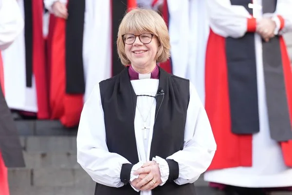 Archbishop of Canterbury Sarah Mullally poses for a photo outside St. Paul’s Cathedral in central London following her confirmation service