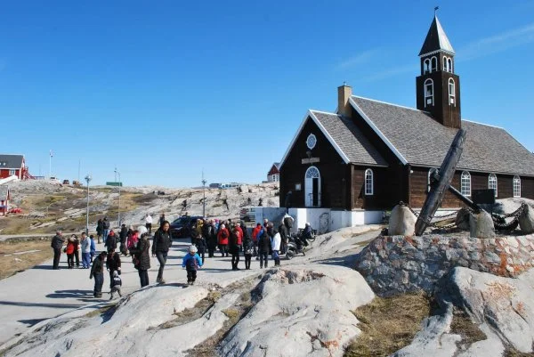 People gather outside Zion Church in Ilulissat, Greenland after Sunday service