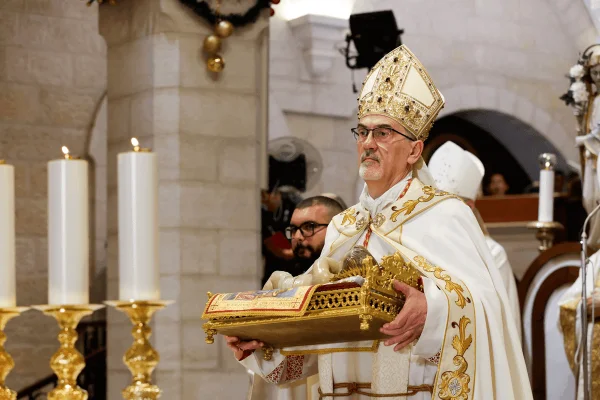Cardinal Pierbattista Pizzaballa, the Latin patriarch of Jerusalem, delivers the homily as he celebrates Christmas Eve Mass at the Church of the Nativity in Bethlehem, West Bank