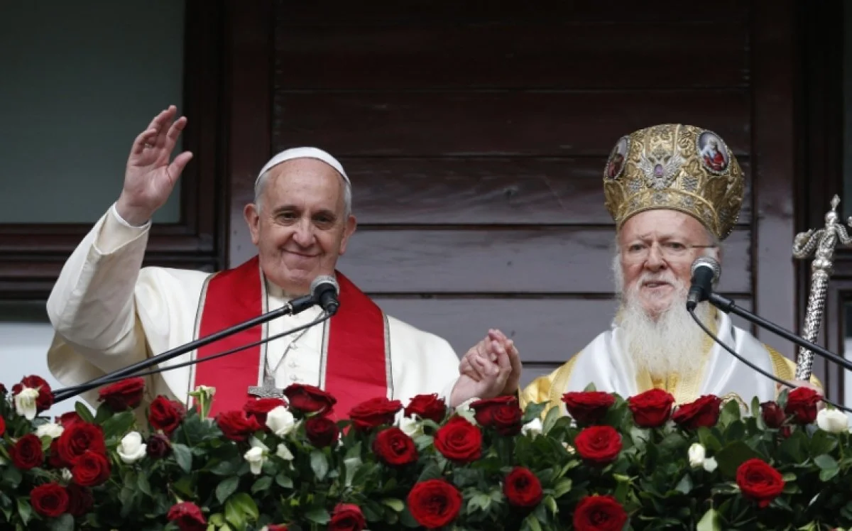 Pope Francis and Patriarch Bartholomew of Constantinople greet a small crowd after delivering a blessing in Istanbul Nov. 30