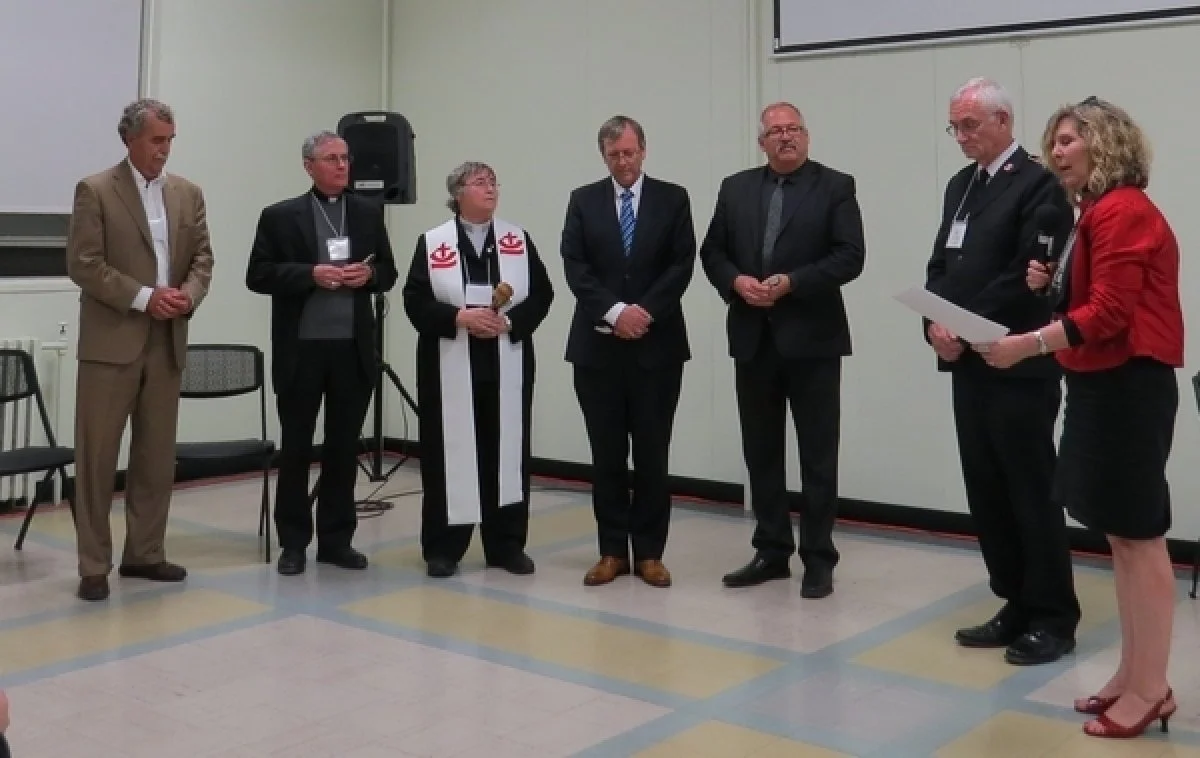 The induction of the CCC executive for the new triennium. L-R: Larry Brennan, treasurer; Bishop Ron Fabbro, Vice President; the Rev. Canon Alyson Barnett-Cowan, President; the Rev. Stephen Kendall, Vice President; the Rev. Dr. Willard Metzger, Vice President; Lt. Col Jim Champ, outgoing President; the Rev. Dr. Karen Hamilton, General Secretary