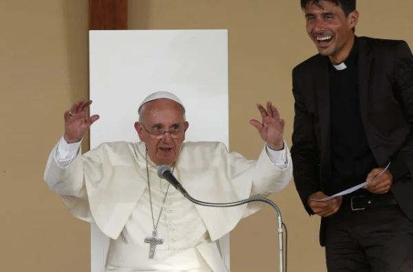 Pope Francis gestures as he leads a gathering with young people in Piazza Vittorio in Turin, Italy