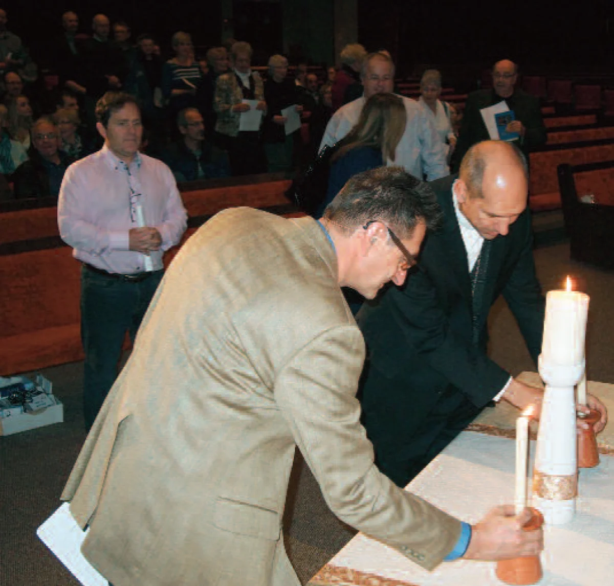 Rev. Eldon Boldt and Bishop Don Bolen lit candles from a central Christ candle to open the worship service at Circle Drive Alliance Church