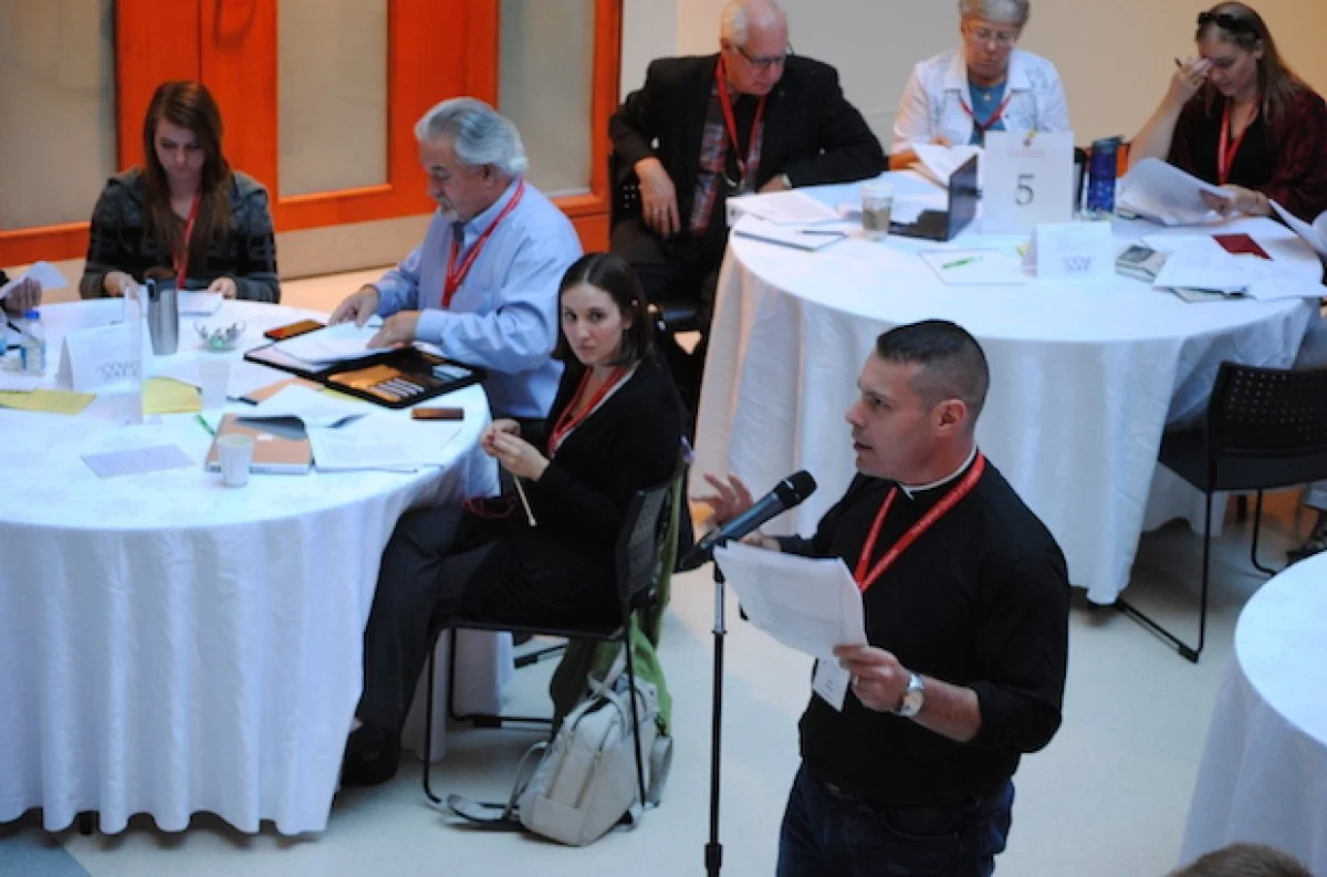 The Rev. Capt. Marc Torchinsky from the Anglican Military Ordinariate of Canada, raises a question after the marriage canon commission presented its report
