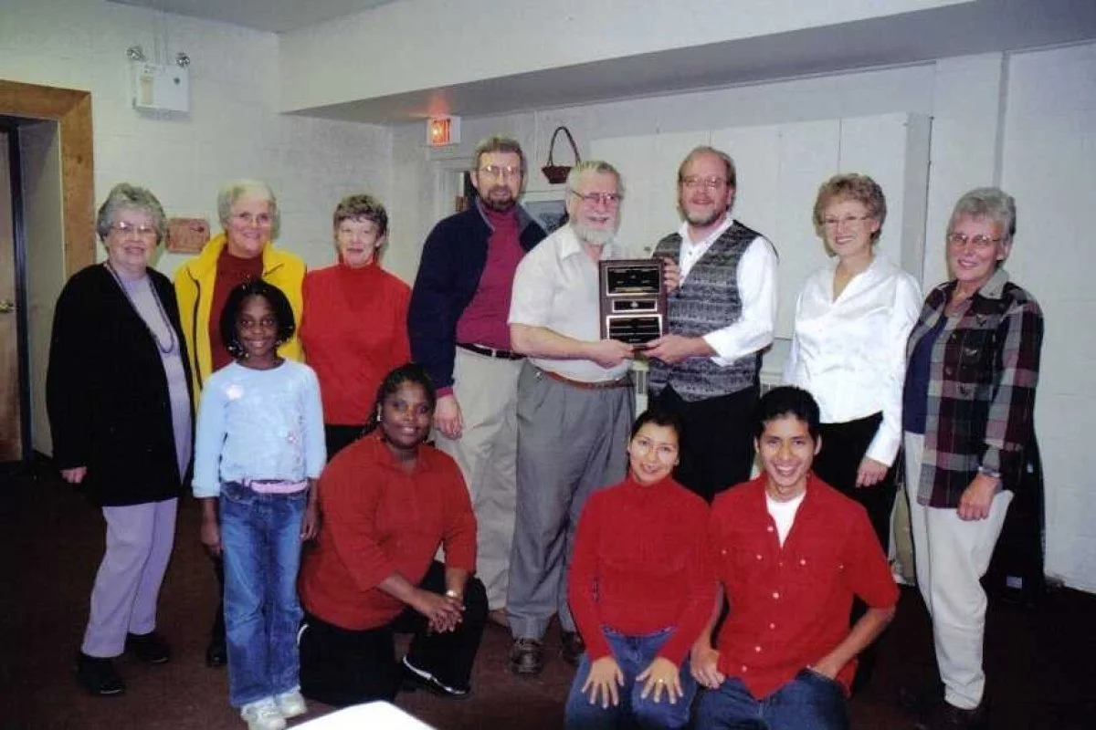 The Nelson Area Refugee Coalition with Dr Stuart Brown and currently sponsored family in front row