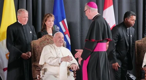Pope Francis is greeted by Archbishop Richard Smith of Edmonton at the formal arrvial ceremony at the Edmonton airport
