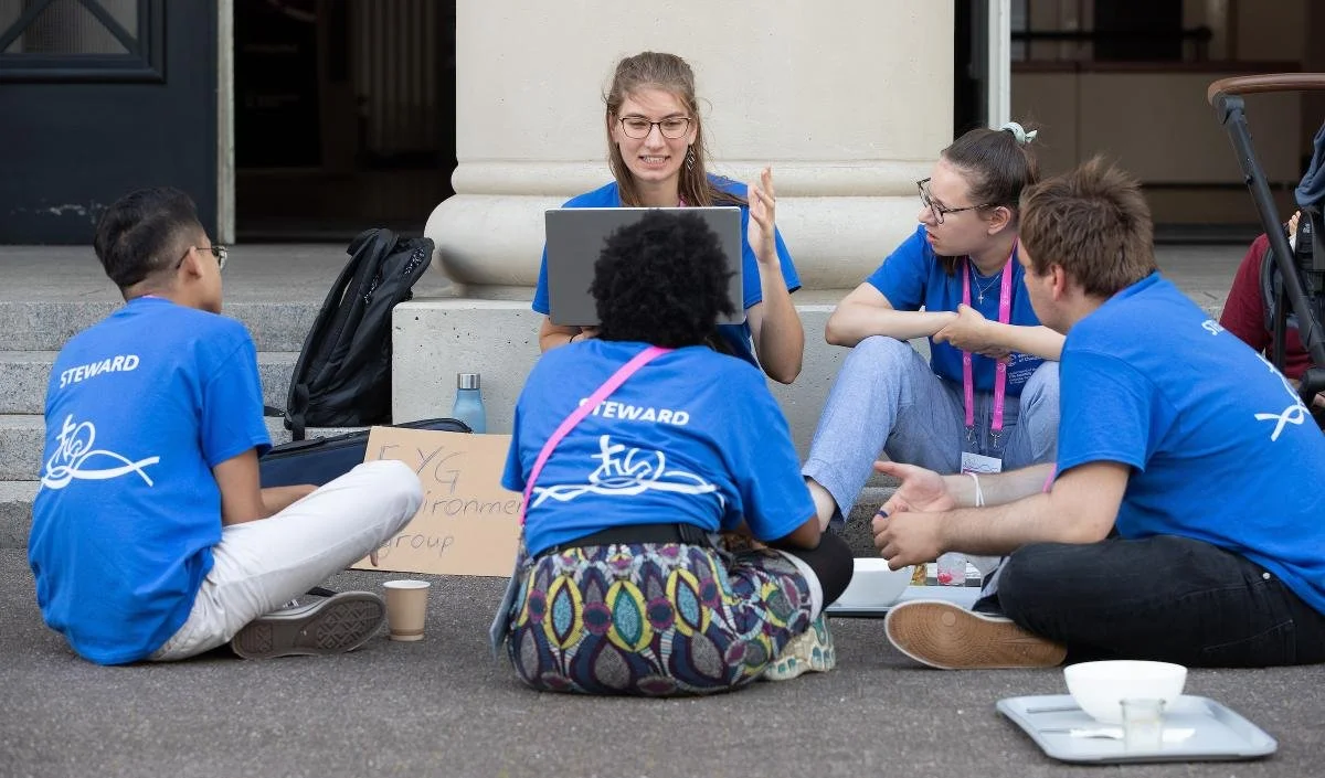 Youth stewards organizing on the steps during lunch