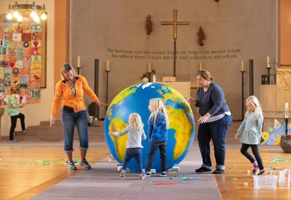 Children enjoy play time in 'Domino World' at St. John's Church in Karlsruhe during the World Council of Churches' 11th Assembly. The assembly takes place August 31 to September 8 under the theme 'Christ's Love Moves the World to Reconciliation and Unity'