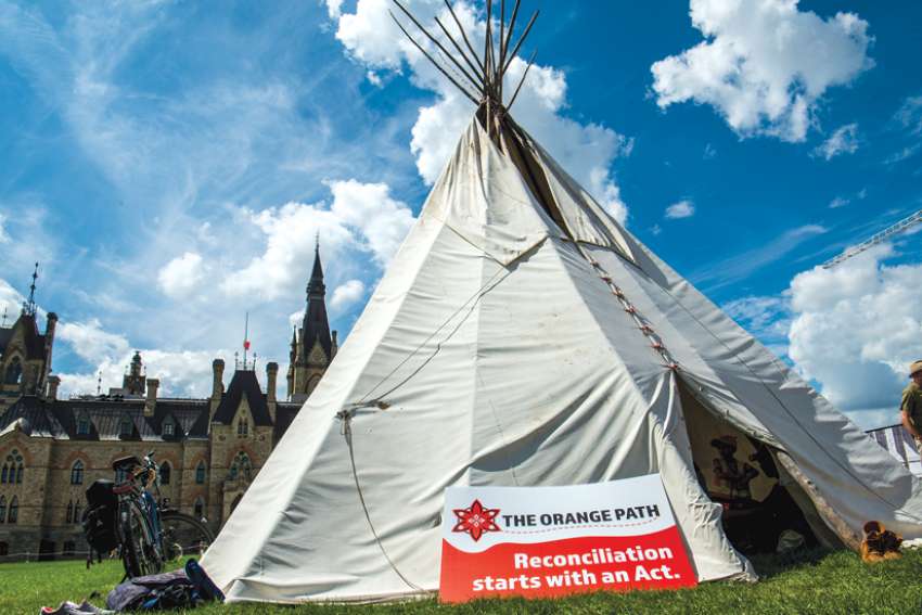 A teepee stands in front of Parliament in Ottawa