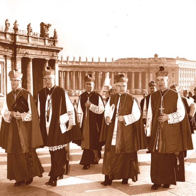 A group of Canadian bishops who took part in the Second Vatican Council walk through St. Peter’s Square, including, third from left, the future Cardinal Gerald Emmett Carter, Archbishop Philip Pocock to his left, and Carter’s brother Alexander, bishop of Sault Ste. Marie, Ontario