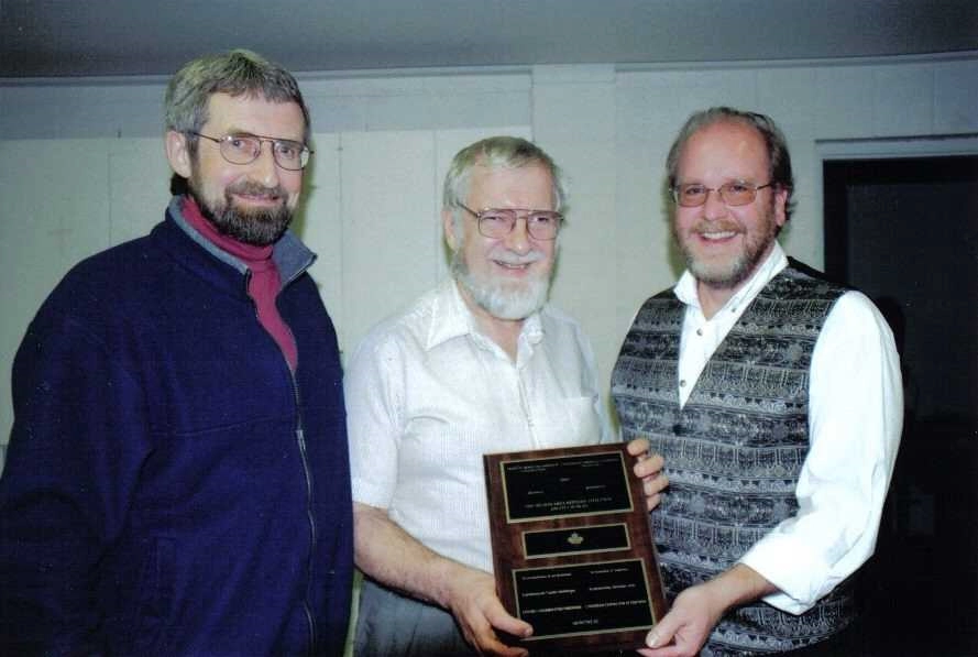 Dr Stuart Brown presenting the 2004 Ecumenical Merit Award, Revd Nolan Gingrich on left and Revd David Boyd on the right