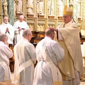 Ottawa Archbishop Terrence Prendergast lays hands on Fr. Jim Tilley of Oshawa, Ont., one of four men ordained to serve as priests in the Anglican Ordinariate. Photo by Deborah Gyapong