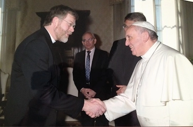 Canon John Gibaut (left), pictured here with Pope Francis, is well-known in ecumenical circles