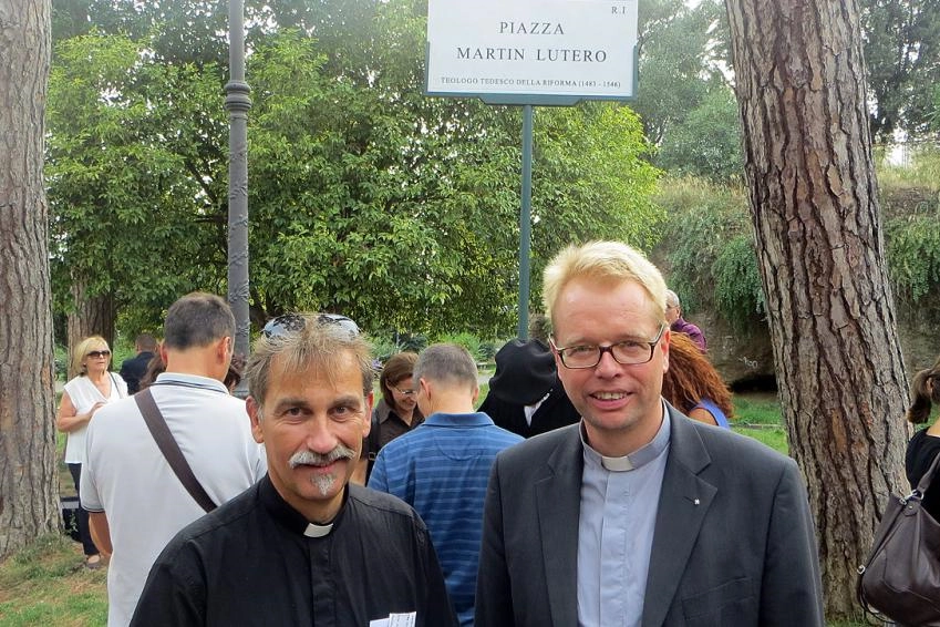 The Piazza Martin Lutero constitutes an ecumenical witness in the daily life of residents and visitors to Rome, says Lutheran pastor Rev. Jens-Martin Kruse (right), who witnessed the inauguration of the public square with hundreds of parish members including Rev. Per Edler (left) of the Swedish-speaking congregation
