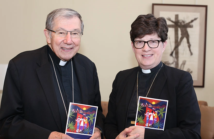 Bishop Denis J. Madden, auxiliary bishop for the Archdiocese of Baltimore and ELCA Presiding Bishop Elizabeth A. Eaton hold copies of Declaration on the Way: Church, Ministry and Eucharist – a unique ecumenical document that makes visible a pathway to Christian unity between Catholics and Lutherans