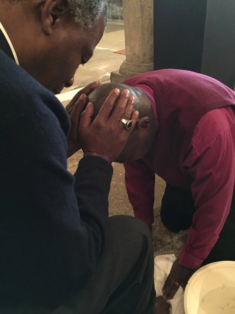 The Archbishop of Cape Town, Thabo Makgoba, posted this picture on Twitter, showing him praying for the Archbishop of York, John Sentamu, as Dr Sentamu washes his feet