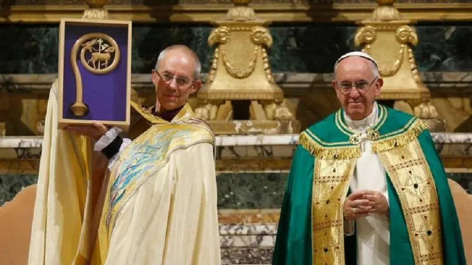 Anglican Archbishop Justin Welby of Canterbury, England, spiritual leader of the Anglican Communion, holds a replica of the crozier of St. Gregory the Great given by Pope Francis at a vespers service at the Church of St. Gregory in Rome