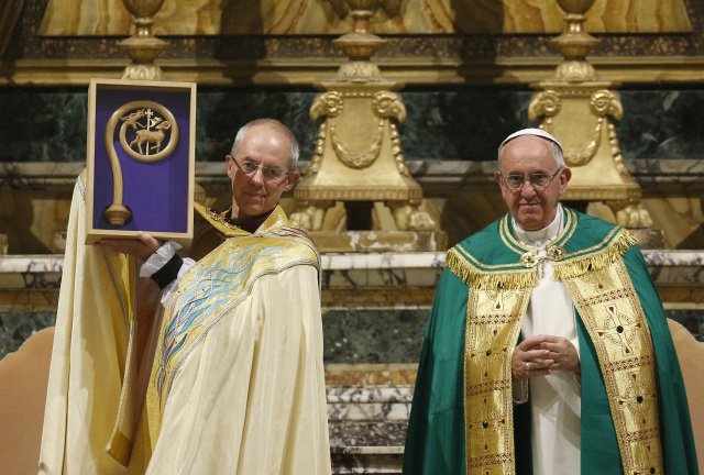 Anglican Archbishop Justin Welby of Canterbury, England, spiritual leader of the Anglican Communion, holds a replica of the crozier of St. Gregory the Great given by Pope Francis at a vespers service at the Church of St. Gregory in Rome on Oct. 5. Photo: CNS/Paul Haring