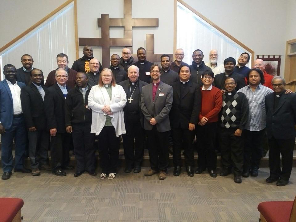 Anglican and Roman Catholic clergy at their one-day ecumenical conference in Slave Lake, Alta., Nov. 15, 2017. Wearing the purple shirt, in the front row, is Fraser Lawton, bishop of the diocese of Athabasca; to his right is Gérard Pettipas, archbishop of the Roman Catholic archdiocese of Grouard-McLennan. Photo: Contributed