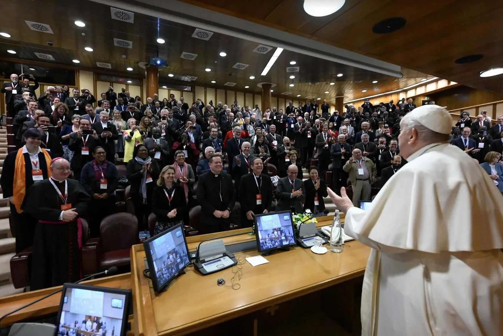Pope Francis greets participants at a Vatican conference, 'Pastors and lay faithful called to walk together,' in the Vatican Synod Hall. The meeting was sponsored by the Dicastery for Laity, the Family and Life