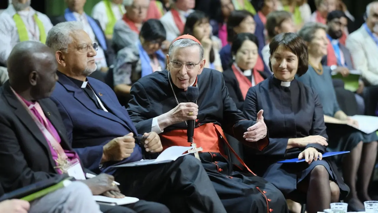 Cardinal Kurt Koch, prefect of the Vatican Dicastery for Promoting Christian Unity, and the Rev. Anne Burghardt, general secretary of the Lutheran World Federation, at the LWF assembly in Krakow, Poland