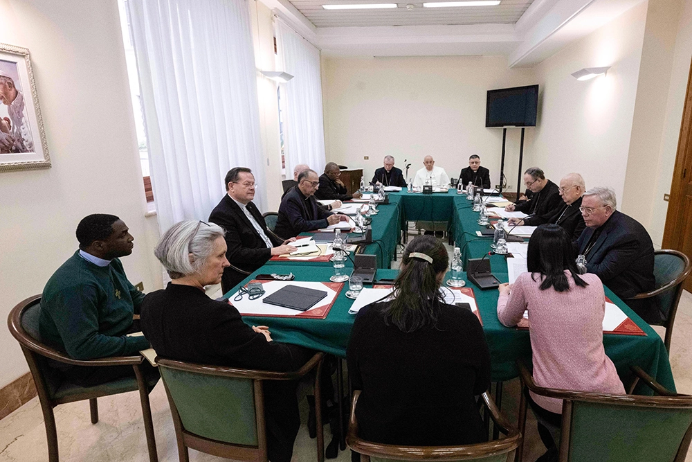 Pope Francis and his international Council of Cardinals continue their discussion of women's role in the church at the Vatican. Pictured, clockwise from the left, are: Cardinals Gérald Lacroix of Québec; Juan José Omella Omella of Barcelona; Seán O'Malley of Boston; Fridolin Ambongo Besungu of Kinshasa, Congo; and Pietro Parolin, Vatican secretary of state. Continuing, to the right of the pope are: Bishop Marco Mellino, council secretary; and Cardinals Oswald Gracias of Mumbai, India; Sérgio da Rocha of São Salvador da Bahia, Brazil; Fernando Vérgez Alzaga, president of the commission governing Vatican City State; and Jean-Claude Hollerich of Luxembourg. Bishop Jo Bailey Wells, deputy secretary-general of the Anglican Communion, left, Salesian Sr. Linda Pocher and Giuliva Di Berardino, a consecrated virgin from the Diocese of Verona, Italy, are the women who addressed the group
