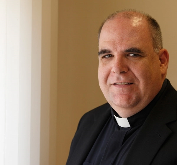 Msgr. Gregory J. Fairbanks, an official at the Pontifical Council for Promoting Christian Unity, is pictured at the council's office at the Vatican. Photo: CNS/Paul Haring