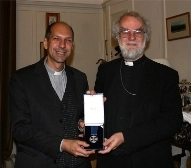 Msgr. Don Bolen receives the Cross of St. Augustine from Archbishop Rowan Williams