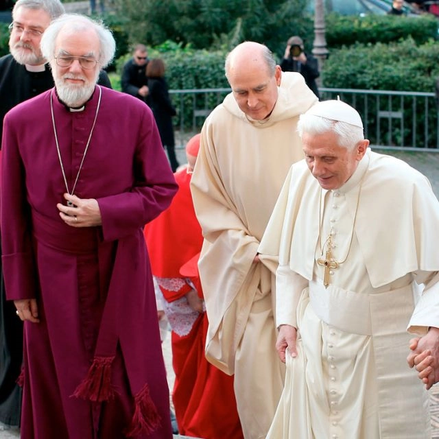 Archbishop Rowan Williams, left, with Pope Benedict XVI walking up stairs as they arrive for vespers at the Basilica of St. Gregory on the Caelian Hill in Rome
