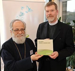 Metropolitan Dr Vasilios of Constantia-Ammochostos, moderator of the Commission on Faith and Order; right, Canon John Gibaut, of the WCC director of Faith and Order, presenting the published version of “The Church, Towards a Common Vision”