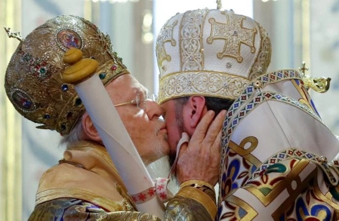 Ecumenical Patriarch Bartholomew of Constantinople kisses Metropolitan Epiphanius, head of the Orthodox Church of Ukraine, as he hands him a decree granting the Orthodox Church of Ukraine independence, at the Patriarchal Cathedral of St. George in Istanbul, Turkey