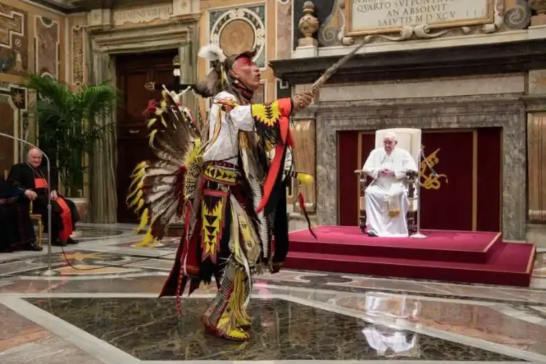 Kevin Scott, a First Nations dancer, performs for Pope Francis in the Vatican's Clementine Hall