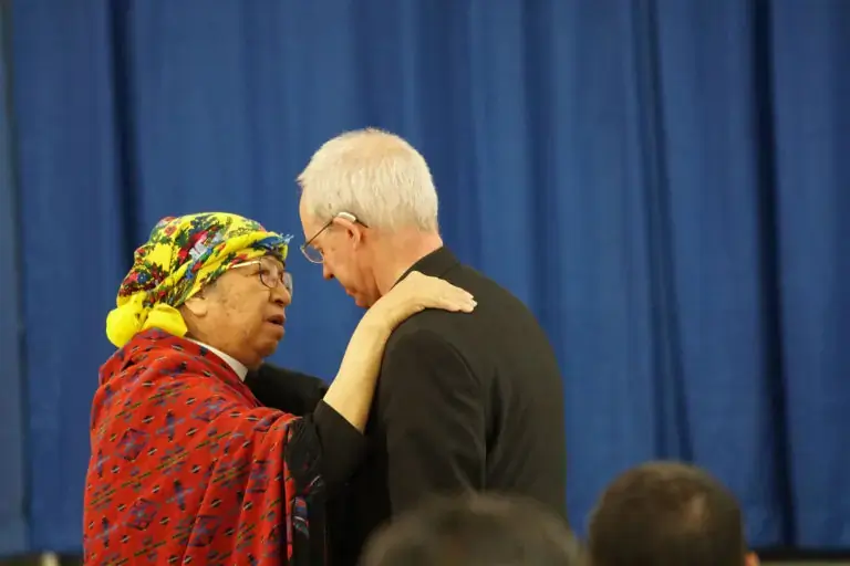Archbishop of Canterbury Justin Welby and the Rev. Helen Northcot embrace after Northcot and others shared their experiences of Indian residential school at a gathering in Prince Albert, Saskatchewan