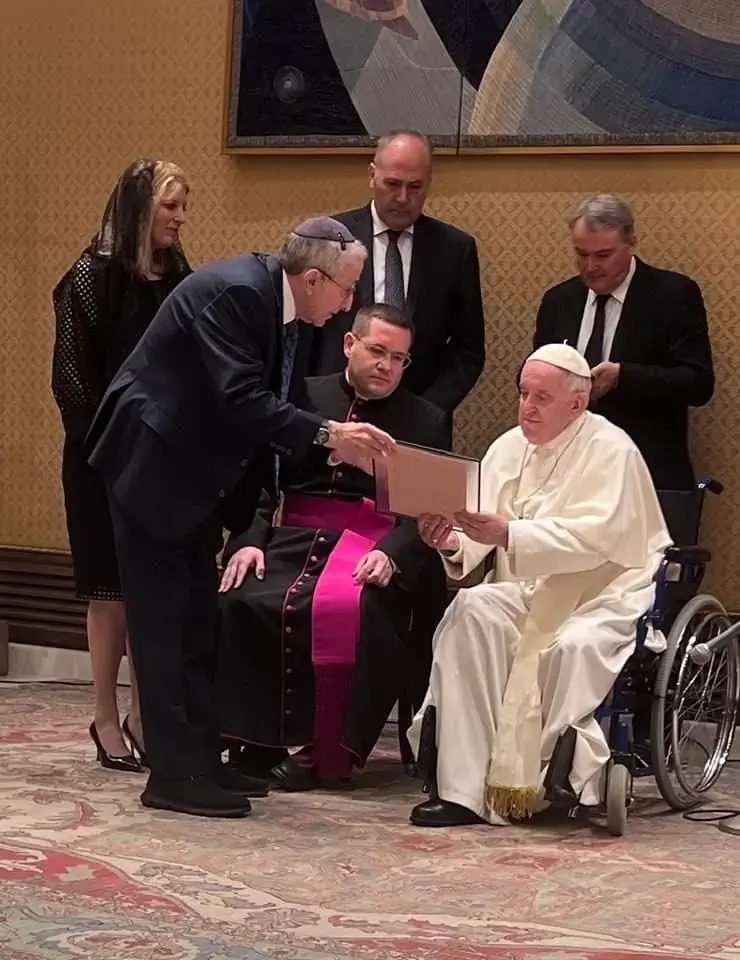 Rabbi Marvin Hier Founder and CEO, Simon Wiesenthal Center (center) with Dawn Arnall, SWC chairwoman present 1919 Hitler letter to Pope Francis at Vatican audience