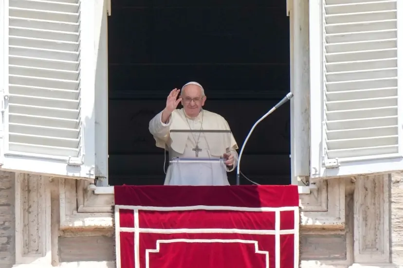 Pope Francis recites the Angelus noon prayer from the window of his studio overlooking St.Peter’s Square, at the Vatican, Sunday