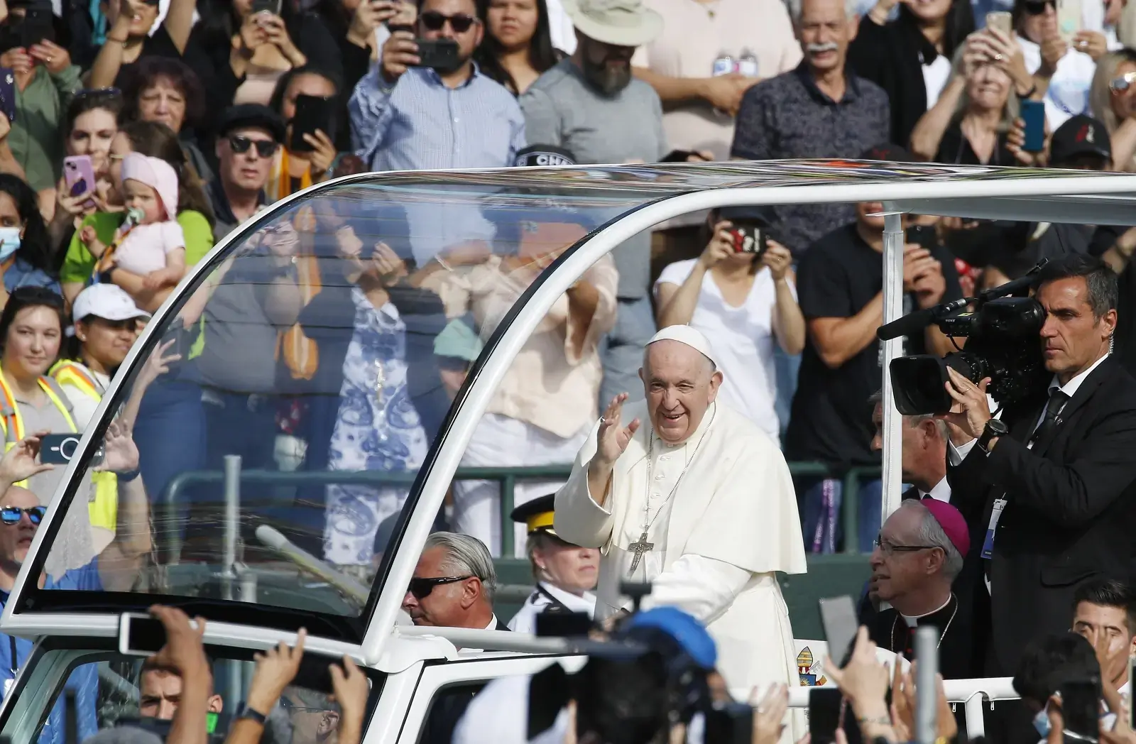 Pope Francis greets the crowd before celebrating Mass at Commonwealth Stadium in Edmonton, Alberta